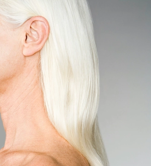 Lady with blonde hair showing ear